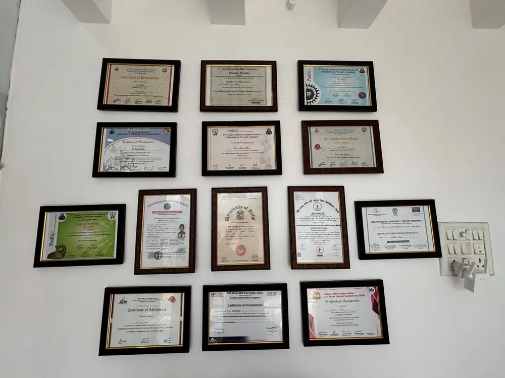 Dr. Sonal Jain's degrees and conference certificates displayed at the clinic